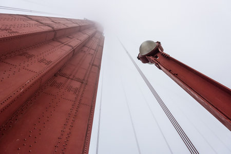 Beneath a giant pillar of the Golden Gate Bridge, San Francisco, USAの写真素材