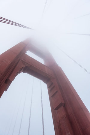 Beneath a giant pillar of the Golden Gate Bridge, San Francisco, USAの写真素材