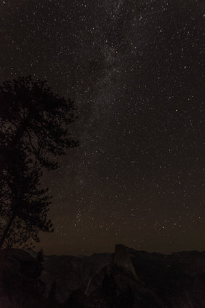 Scenic night sky above the famous Half Dome mountain, Yosemite NP, USAの写真素材