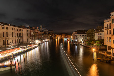 View on Grand Canal at Night, Boats passing by, Venice, Italyの写真素材