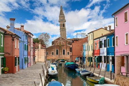 Colorful houses in Burano beneath a scenic sky, Island of Venice, Italyの写真素材