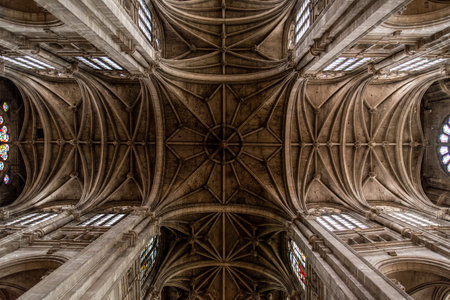 Tall columns and beautifully ornate ceiling in the gothic church Saint Eustache in Paris, Franceのeditorial素材