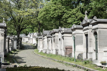 Peaceful way on the famous Parisian cemetery Pere Lachaise, France