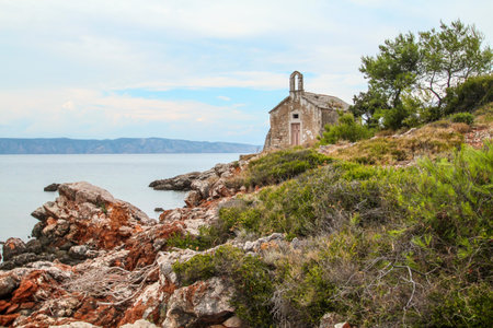 Beautiful little abandoned chapel on the coast of Hvar island, Croatiaの写真素材