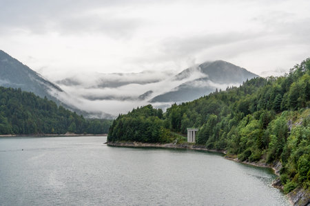Sylvenstein Reservoir in the Alps of Upper Bavaria, Clouds hanging low in the Mountains, Germanyの写真素材