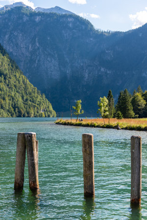 Bollards at the Pier Saint Bartholomew at the upper Lake Koenigssee in Bavaria, Germanyの写真素材