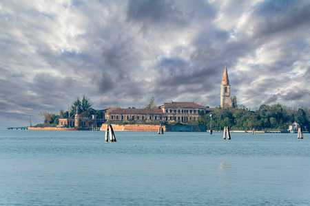 View from Lido to abandoned Poveglia Island, a former Psychiatric Hospital in Venice, Italyの写真素材