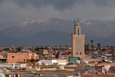 Scenic view of the Marrakech medina and the Atlas mountains in the background during stormy weather, Moroccoの写真素材