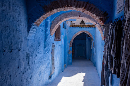 Vibrant blue colored alley in downtown Chefchaouen, Moroccoの写真素材
