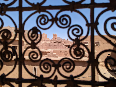 Ornate traditional window grid of a Berber house ruin in the city center of Amezrou, Morocco