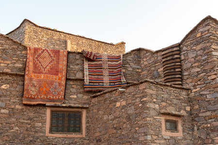 Carpets hanging from a roof in a Moroccan village somewhere in the Anti-Atlasの写真素材