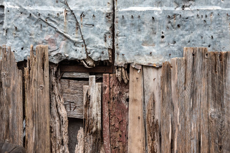 An old repaired fence made of wood and metal, somewhere in the town of Amalfi, Italyの写真素材