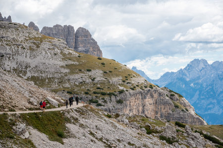 Hiking with a dog around the scenic 3 Zinnen mountains in the Dolomites, South Tyrolの写真素材