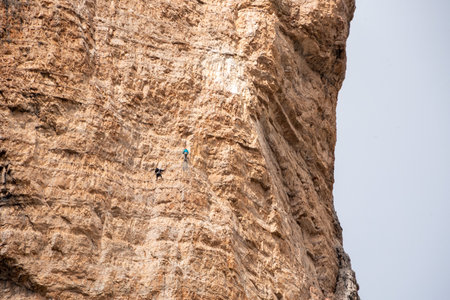 Mountaineers climbing up the 3 Zinnen in the Dolomite mountains, South Tyrolの写真素材