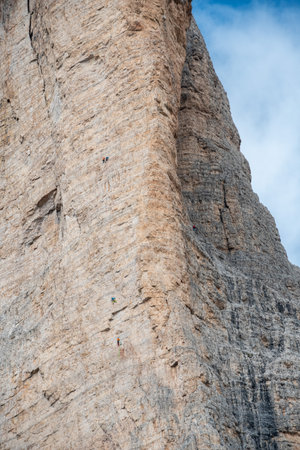 Mountaineers climbing up the 3 Zinnen in the Dolomite mountains, South Tyrolの写真素材