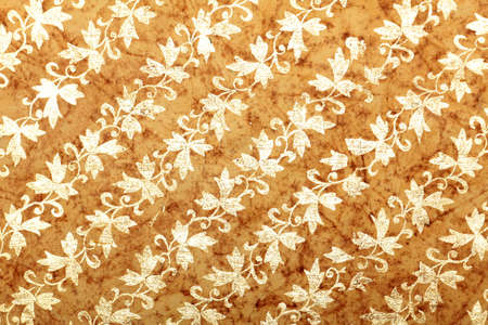 brown handmade art paper with diagonal floral patternの写真素材