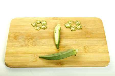 happy face Fresh raw okra isolated on white background
の写真素材