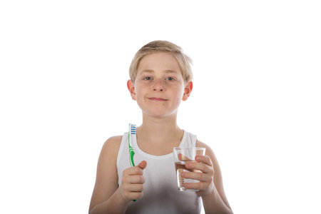 a boy brushing his teeth