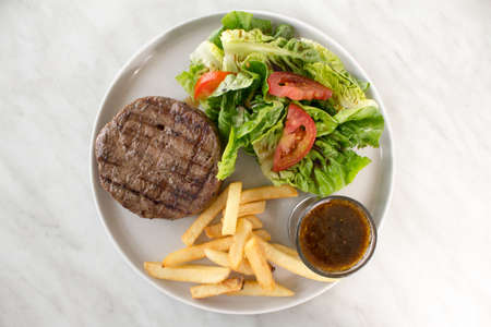 Beef Steak with Salad and French Friesの写真素材