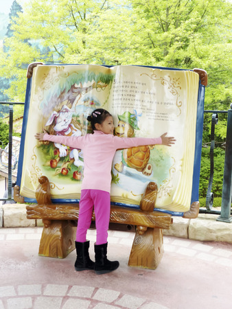 Hug the bookの写真素材