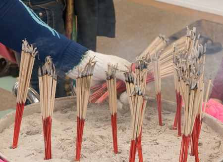 Incense smoke in pots with global warmingの写真素材