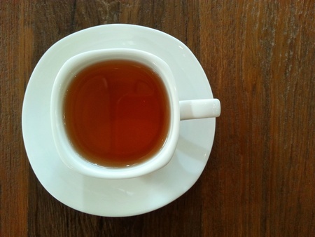 Hot tea on wood backgroundの写真素材