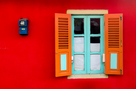 Window at red wallの写真素材