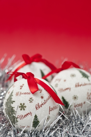 Christmas balls and decoration on red backgroundの写真素材