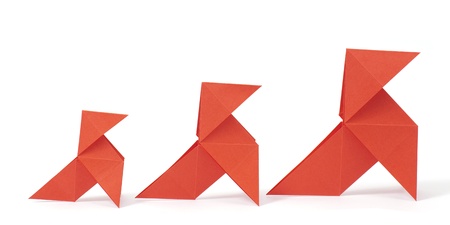 Three origami birds on white background. Concept of growth.の写真素材