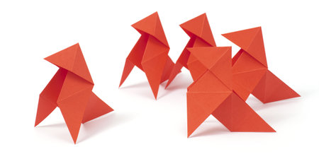Five origami birds on white background. Concept of mobbing/bullying