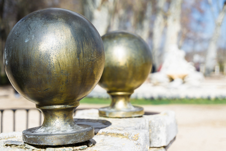 Close-up of two bronze round bridge details in sunlightの写真素材