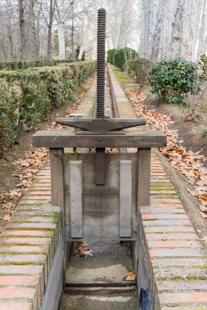 Ancient or medieval iron construction to block water in royal parkの写真素材