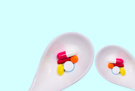 Pill is placed in a white spoon.の写真素材
