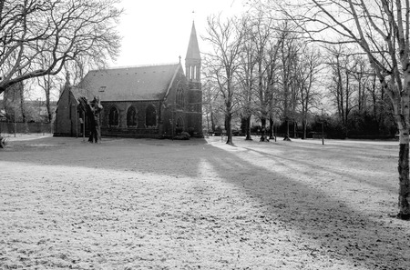 A small church in York in the UK after some snowfall during Winter, in black and white.の写真素材