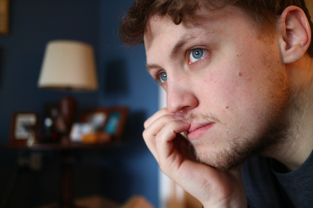 A young man looking off camera.の写真素材