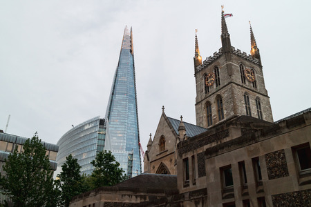 London, United Kingdom - 05/11/2018: Southwark cathedral, with the shard towering in the background.のeditorial素材