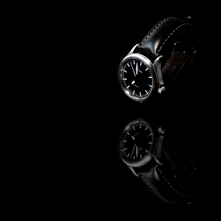 York, United Kingdom - 05/17/2018: A well-worn Sinn 556 I automatic watch, made in Germany. Isolated on a black background.のeditorial素材