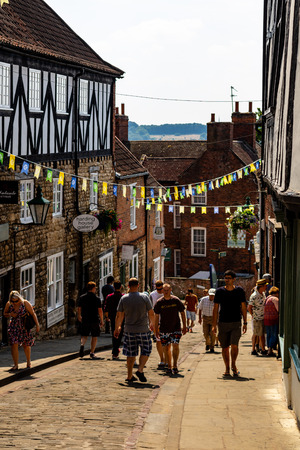 Lincoln, United Kingdom - 07/21/2018: part way up Steep Hill in Lincoln looking down.のeditorial素材