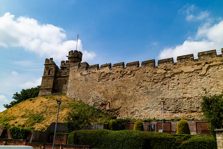 Lincoln, United Kingdom - 07/21/2018: Lincoln Castle wall during the day. Lincoln Castle is an old Norman castle built on the pre-existing remains of a Roman one. It is only one of two of it's kind in the UK as it has two mottes.のeditorial素材