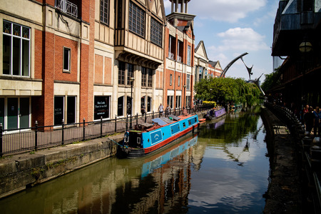 Lincoln, United Kingdom - 07/21/2018: The River Witham going through the centre of Lincoln, with the empowerment sculpture in backgroundのeditorial素材