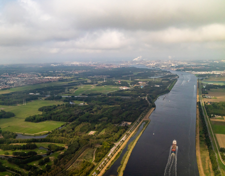 An aerial view of the river Amstel flowing into Amsterdam in the Netherlandsの写真素材