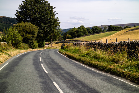 A road running through the Yorkshire Dales in the English countrysideの写真素材