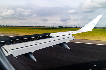 Amsterdam, The Netherlands - 08/15/2018: A KLM flight safely landing in Amsterdam with flaps deployedのeditorial素材