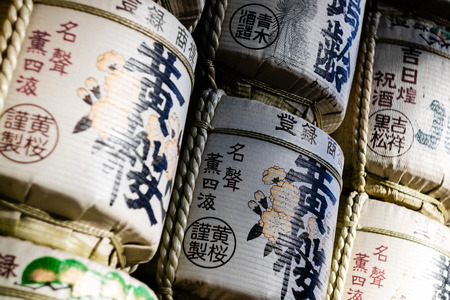 Tokyo, Japan - 17/2/2017: Stacked Japanese sake barrels on the path that leads up to Meiji Jingu shrine in Tokyo, Japan.のeditorial素材