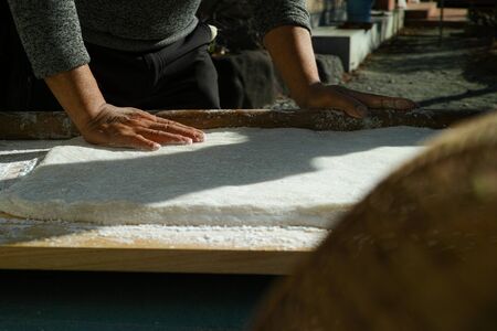 Mochi being pushed flat ready to make into mochi balls for the new yearの写真素材