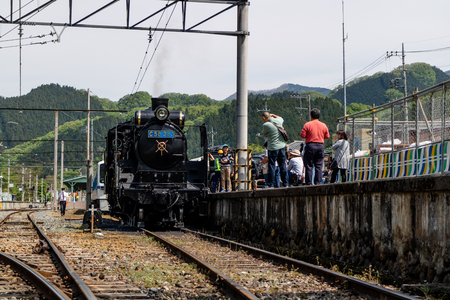 Chichibu, Japan - 05/03/2019: Tourists looking at the famous steam engine in Chichubu, Japanのeditorial素材