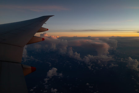 A beautiful sunset as seen through the window of an aeroplane