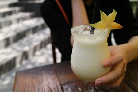 A fresh pinapple flavoured tropical cocktail ready to drink, pina coladaの写真素材