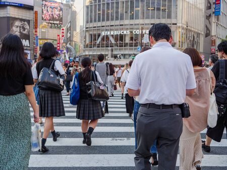 Shibuya, Japan - 23 9 19: A business man In the crowd crossing the Shibuya scrambleのeditorial素材