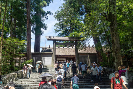 Ise, Japan - 28 6 19: Tourists praying at the main shrine building at ise jingu shrineのeditorial素材